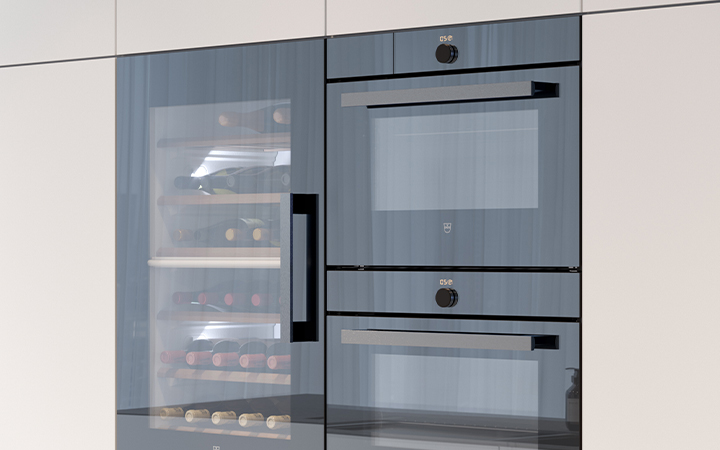 Two kitchen ovens and a wine cooler with open clear glass doors