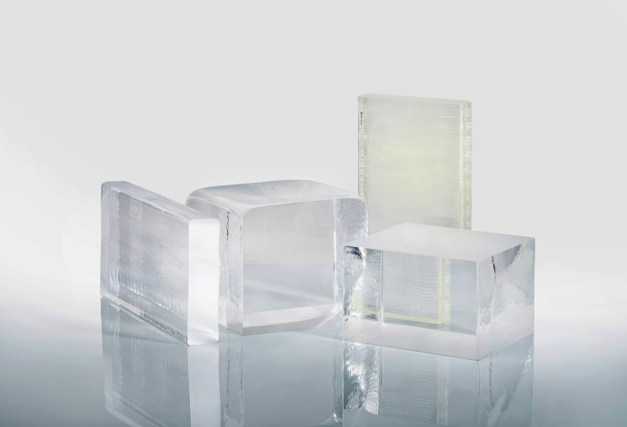 A small selection of SCHOTT's 120 types of optical glass A range of clear SCHOTT optical filter glasses in different shapes