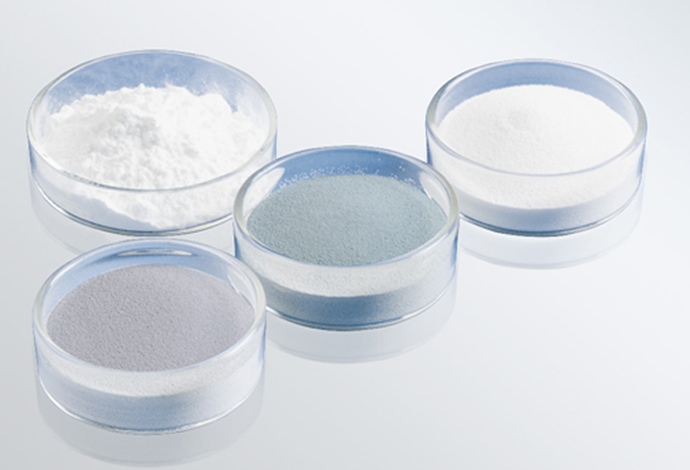 SCHOTT produce passivation glasses for a range of semiconductors and varistors Four glass bowls with different glass powders in various grain sizes and colors