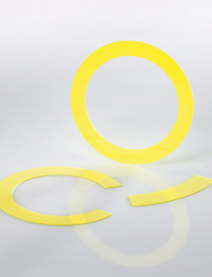 Yellow circle, C-shape and a concentric line indicating laser light shapes made with a ceramic laser phosphor converter